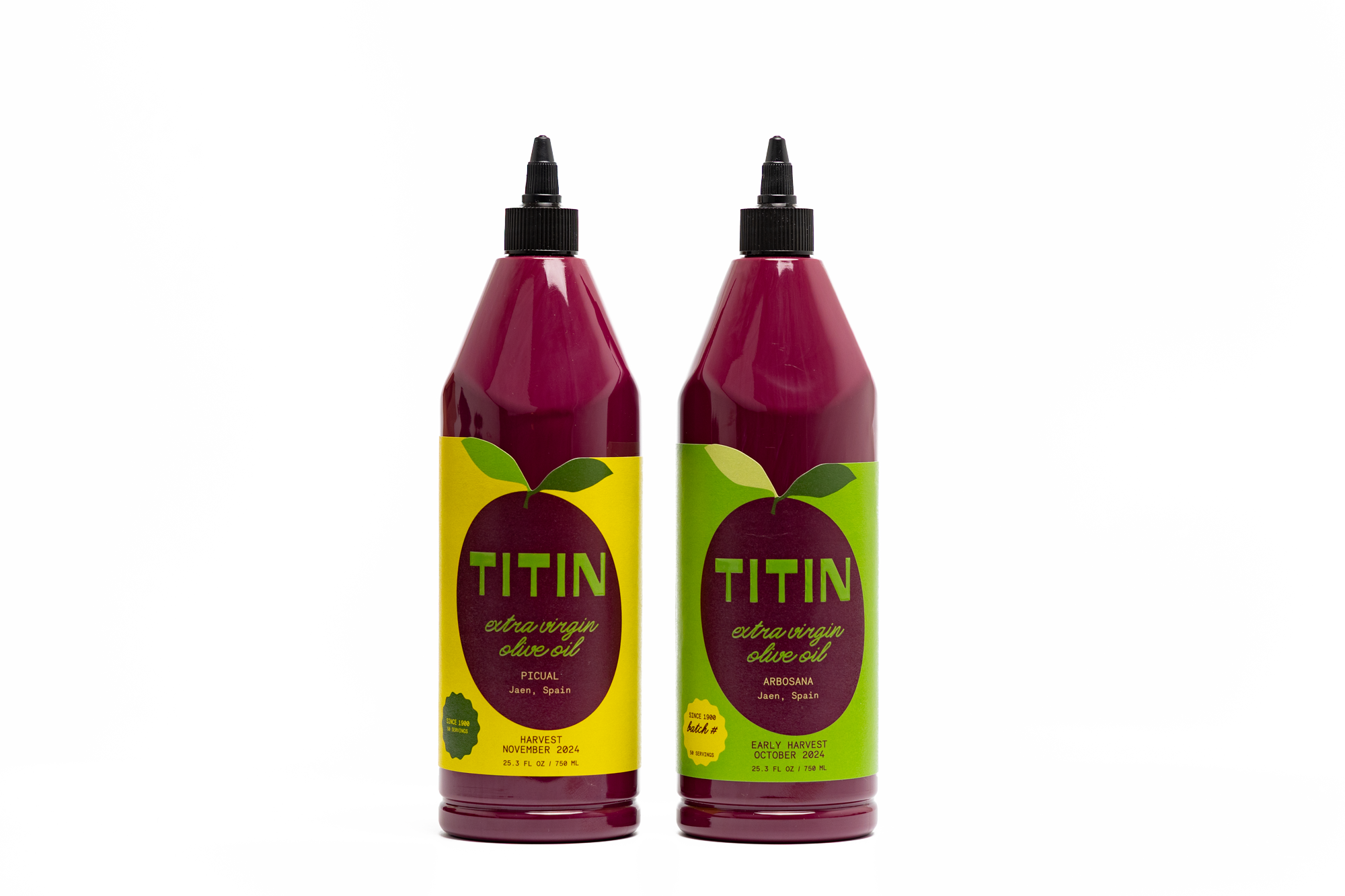 Two bottles of our premium extra virgin olive oil: Universal Picual Everyday EVOO for versatile cooking and Finishing Arbosana EVOO for delicate flavors.